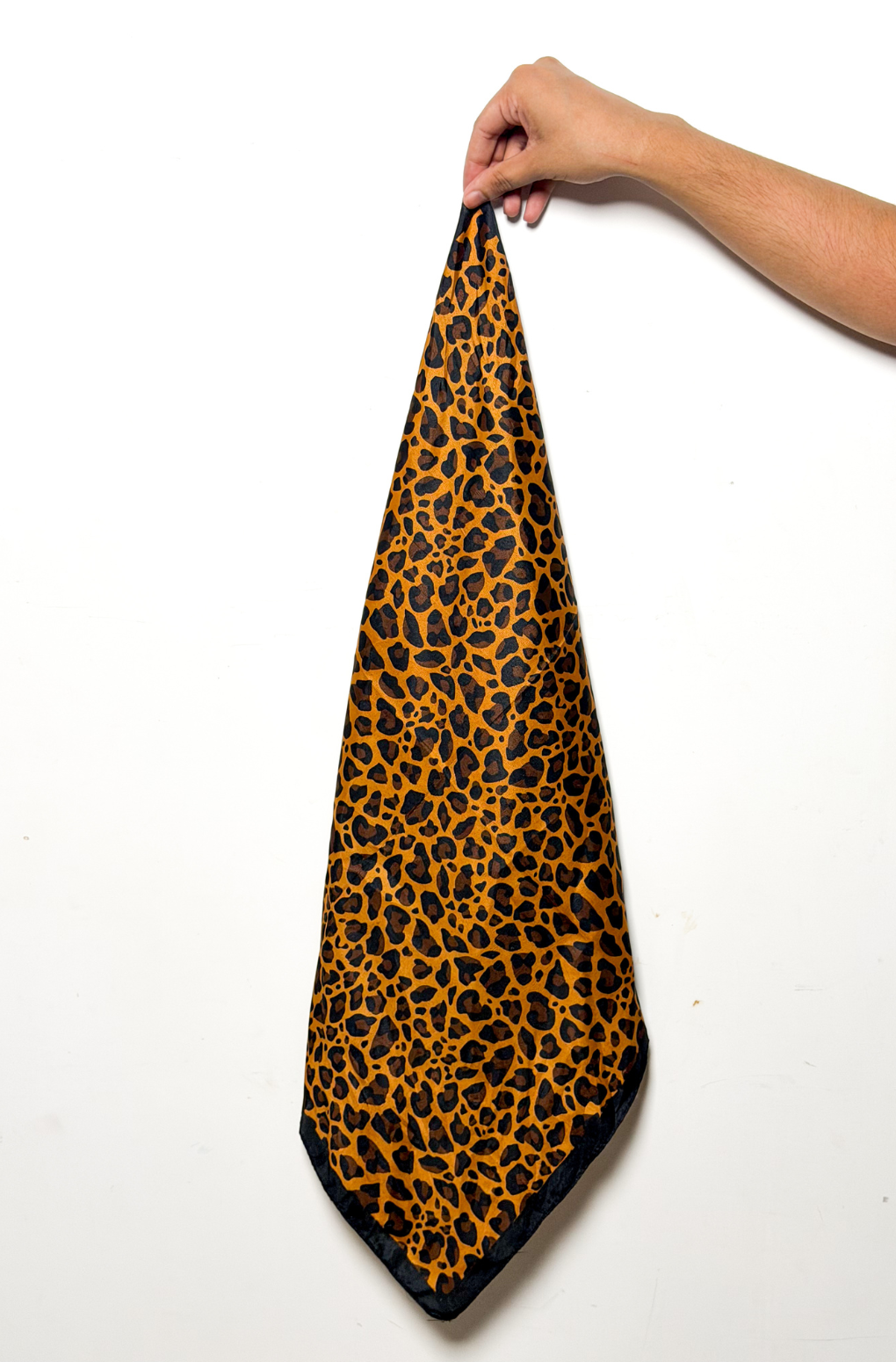 Orange and black leopard print bandana