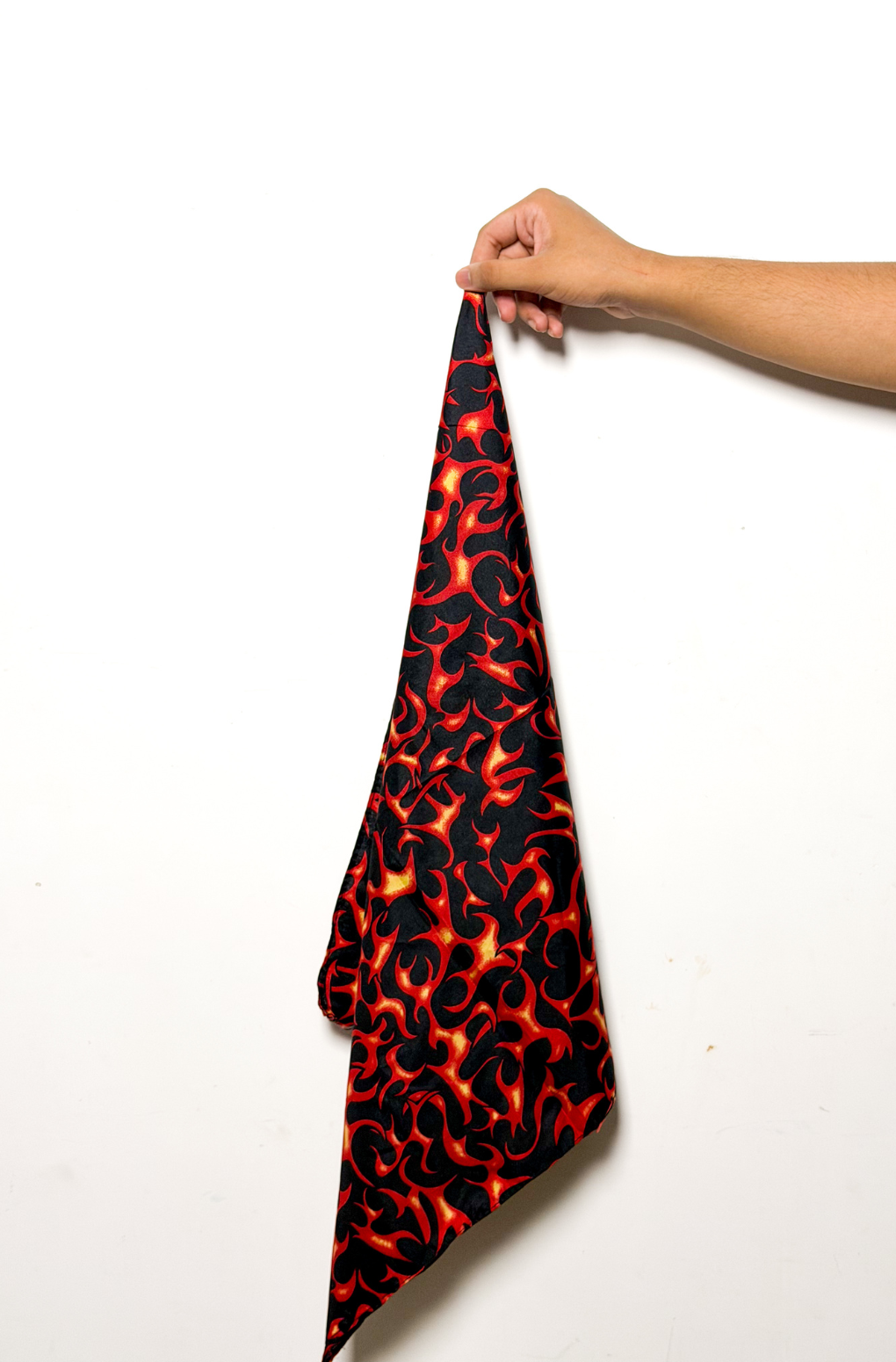 Black bandana with printed red and yellow tribal flame design