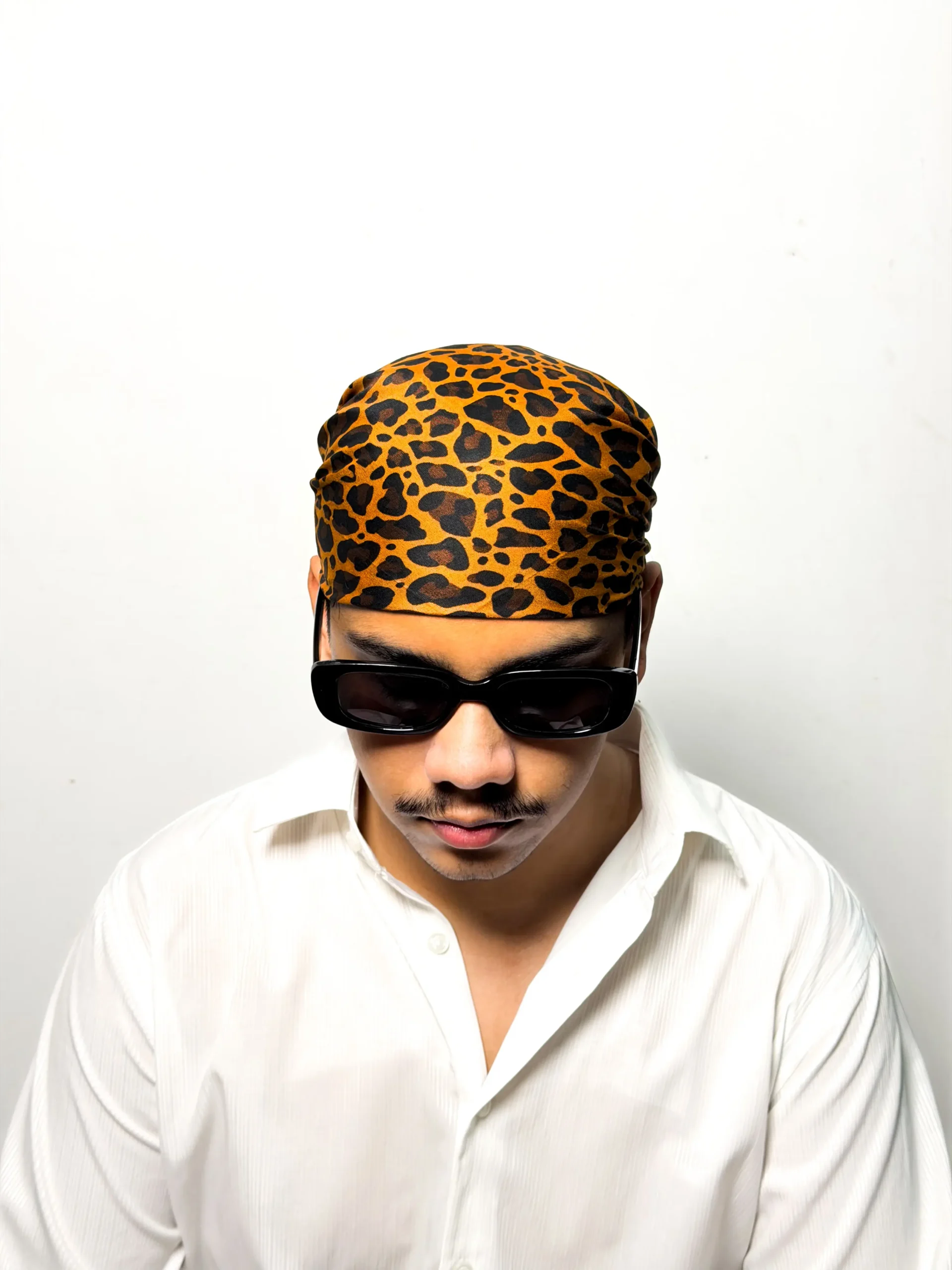 Orange and black leopard print bandana