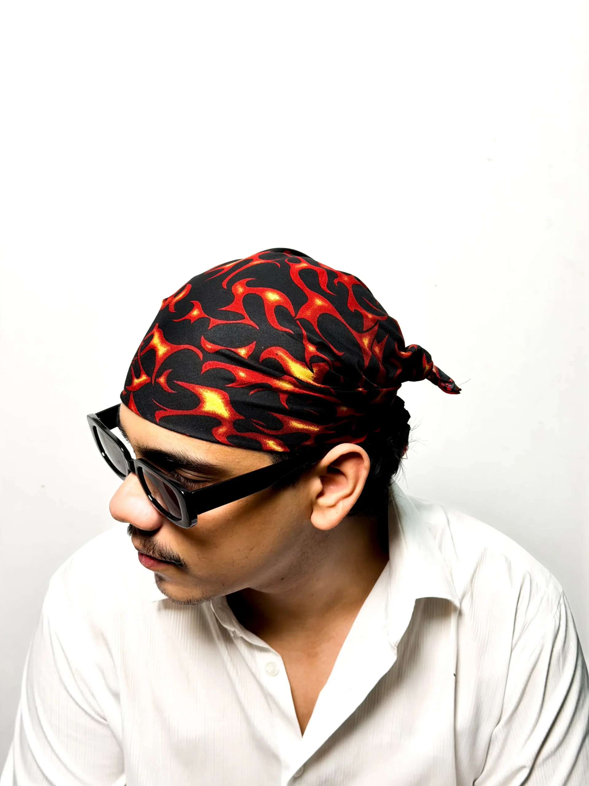 Black bandana with printed red and yellow tribal flame design